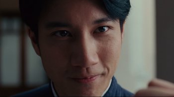 Movie still from “Lust, Caution” (2007), directed by Ang Lee – A man's face with blue eyes; Extreme Close Up shot, Low angle