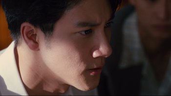 Movie still from “Lust, Caution” (2007), directed by Ang Lee – A young man's face; Close Up shot, Low angle