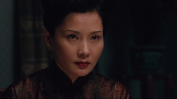 Movie still from “Lust, Caution” (2007), directed by Ang Lee – A person wearing a dress; Close Up shot, Over the shoulder angle