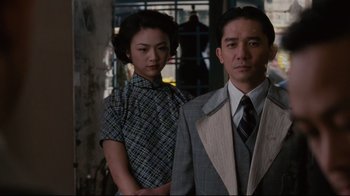 Movie still from “Lust, Caution” (2007), directed by Ang Lee – A man and a woman standing next to each other; Medium shot, Low angle