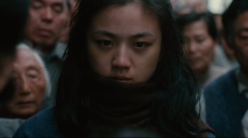 Movie still from “Lust, Caution” (2007), directed by Ang Lee – A person wearing a scarf; Close Up shot, Low angle