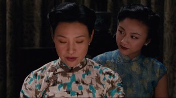 Movie still from “Lust, Caution” (2007), directed by Ang Lee – Two asian women in traditional dress looking at each other; Close Up shot, Over the shoulder angle
