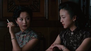 Movie still from “Lust, Caution” (2007), directed by Ang Lee – Two women sitting in a room talking to each other; Close Up shot, Over the shoulder angle