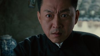 Movie still from “Lust, Caution” (2007), directed by Ang Lee – A person wearing a black shirt; Close Up shot, Low angle