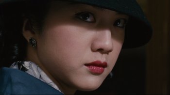 Movie still from “Lust, Caution” (2007), directed by Ang Lee – A person wearing a hat; Close Up shot, Low angle