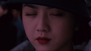 Movie still from “Lust, Caution” (2007), directed by Ang Lee – A person with closed eyes; Close Up shot, High angle