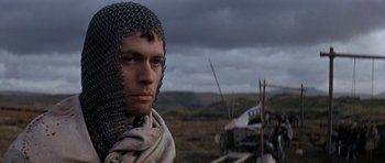 Movie still from “Macbeth” (1971), directed by Roman Polanski – A man with a chain mail helmet on; Close Up shot, Low angle