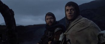 Movie still from “Macbeth” (1971), directed by Roman Polanski – Two men dressed in medieval garb are posing for a picture; Close Up shot, Low angle