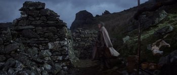 Movie still from “Macbeth” (1971), directed by Roman Polanski – A man walking in the dark with a cape on; Wide shot, Low angle