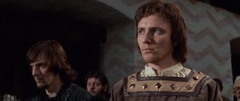 Movie still from “Macbeth” (1971), directed by Roman Polanski – A person wearing a costume; Close Up shot, Low angle