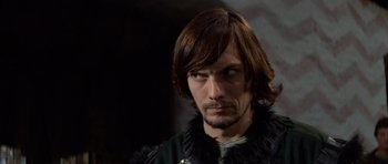 Movie still from “Macbeth” (1971), directed by Roman Polanski – A person with long brown hair; Close Up shot, Over the shoulder angle