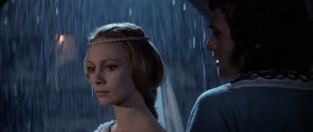 Movie still from “Macbeth” (1971), directed by Roman Polanski – A man and a woman standing next to each other in the rain; Close Up shot, Over the shoulder angle