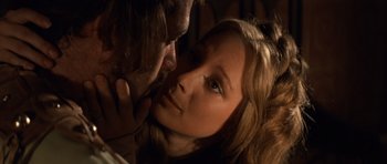 Movie still from “Macbeth” (1971), directed by Roman Polanski – A man and a woman are kissing in a room; Close Up shot, Over the shoulder angle