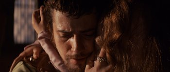 Movie still from “Macbeth” (1971), directed by Roman Polanski – A person with their hand on his face; Close Up shot, Over the shoulder angle
