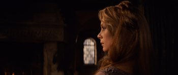 Movie still from “Macbeth” (1971), directed by Roman Polanski – A beautiful young woman with long red hair looking to the side; Close Up shot, Over the shoulder angle
