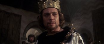 Movie still from “Macbeth” (1971), directed by Roman Polanski – A person wearing a crown; Close Up shot, Low angle