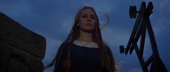 Movie still from “Macbeth” (1971), directed by Roman Polanski – A woman with long hair is standing in the dark; Close Up shot, Low angle