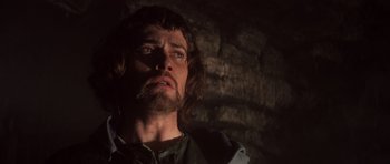 Movie still from “Macbeth” (1971), directed by Roman Polanski – A person with long hair and a beard; Close Up shot, Over the shoulder angle