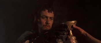 Movie still from “Macbeth” (1971), directed by Roman Polanski – A person holding a cup; Close Up shot, Low angle