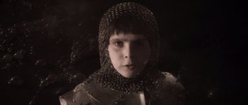 Movie still from “Macbeth” (1971), directed by Roman Polanski – A young boy wearing a chain mail hood; Close Up shot, High angle