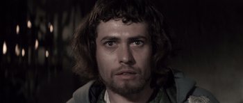 Movie still from “Macbeth” (1971), directed by Roman Polanski – A person with long hair; Close Up shot, Low angle