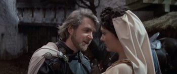 Movie still from “Macbeth” (1971), directed by Roman Polanski – A man and a woman in medieval garb talking to each other; Close Up shot, Over the shoulder angle