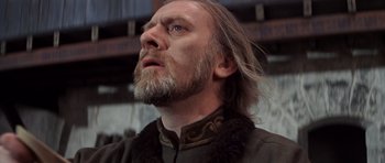 Movie still from “Macbeth” (1971), directed by Roman Polanski – A person with long hair and a beard; Close Up shot, Low angle
