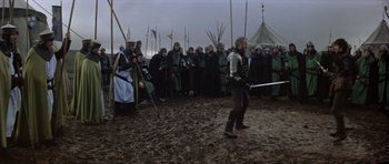 Movie still from “Macbeth” (1971), directed by Roman Polanski – A group of people dressed in medieval clothing; Wide shot, High angle