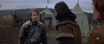 Movie still from “Macbeth” (1971), directed by Roman Polanski – Two men in medieval garb talking in a field; Medium shot, Over the shoulder angle
