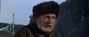 Movie still from “Macbeth” (1971), directed by Roman Polanski – An old man wearing a fur hat and a fur coat; Close Up shot, Low angle