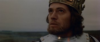 Movie still from “Macbeth” (1971), directed by Roman Polanski – A person wearing a suit of armor; Close Up shot, Low angle