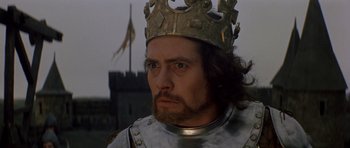 Movie still from “Macbeth” (1971), directed by Roman Polanski – A person wearing a crown; Close Up shot, Low angle