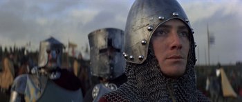 Movie still from “Macbeth” (1971), directed by Roman Polanski – A person wearing a metal helmet; Close Up shot, Low angle
