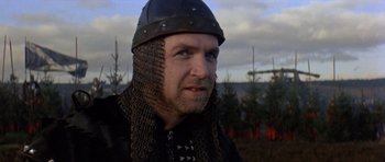 Movie still from “Macbeth” (1971), directed by Roman Polanski – A person wearing a helmet; Close Up shot, Low angle