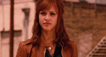 Movie still from “Machete” (2010), directed by Robert Rodriguez – A beautiful young woman with long , red hair; Close Up shot, Over the shoulder angle