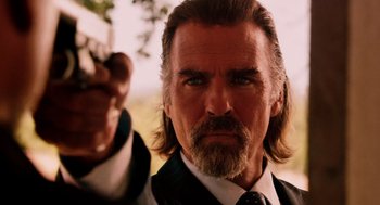 Movie still from “Machete” (2010), directed by Robert Rodriguez – A person holding a gun in his hand; Close Up shot, Low angle
