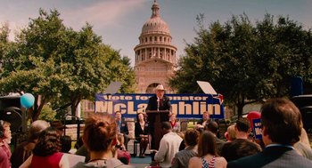 Movie still from “Machete” (2010), directed by Robert Rodriguez – A man is giving a speech in front of the texas state capitol; Wide shot, High angle
