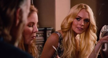 Movie still from “Machete” (2010), directed by Robert Rodriguez – Two women sitting in front of each other; Close Up shot, Over the shoulder angle