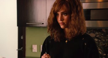 Movie still from “Machete” (2010), directed by Robert Rodriguez – A woman in a black shirt is holding a pencil; Close Up shot, Over the shoulder angle