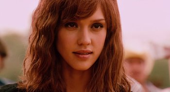 Movie still from “Machete” (2010), directed by Robert Rodriguez – A woman's face with long red hair; Close Up shot, Over the shoulder angle