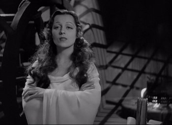 Movie still from “Mad Love” (1935), directed by Karl Freund – A black - and - white photo of a woman with long hair; Medium shot, Low angle