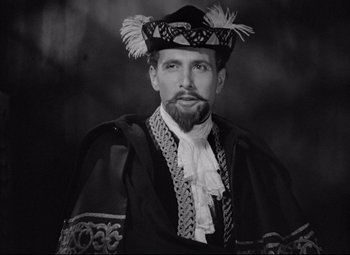 Movie still from “Mad Love” (1935), directed by Karl Freund – Black and white photograph of a man wearing a hat; Close Up shot, Over the shoulder angle