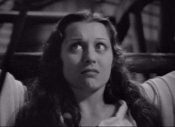 Movie still from “Mad Love” (1935), directed by Karl Freund – A black - and - white photo of a woman looking up; Close Up shot, High angle