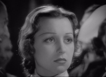 Movie still from “Mad Love” (1935), directed by Karl Freund – A woman's face in a black and white photo; Close Up shot, High angle