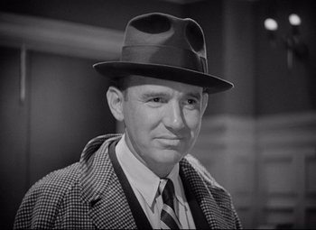 Movie still from “Mad Love” (1935), directed by Karl Freund – An older man wearing a hat and a jacket; Close Up shot, Low angle