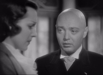 Movie still from “Mad Love” (1935), directed by Karl Freund – A man and a woman looking at one another; Close Up shot, Over the shoulder angle