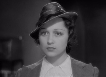 Movie still from “Mad Love” (1935), directed by Karl Freund – A black and white photo of a woman wearing a hat; Close Up shot, High angle