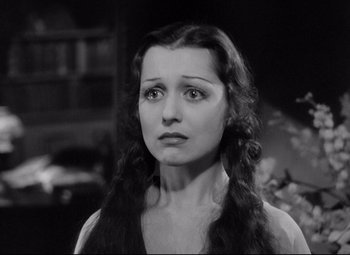 Movie still from “Mad Love” (1935), directed by Karl Freund – A black - and - white photo of a woman looking at the camera; Close Up shot, High angle