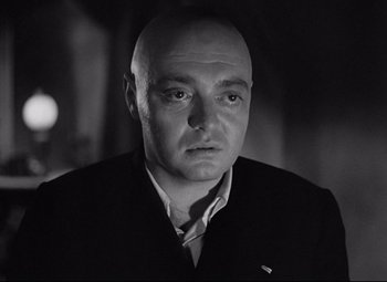 Movie still from “Mad Love” (1935), directed by Karl Freund – Black and white photograph of a man with a bald head; Close Up shot, Low angle