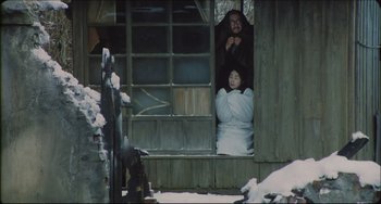 Movie still from “Madadayo” (1993), directed by Akira Kurosawa – A man and a woman looking out of a window; Wide shot, High angle
